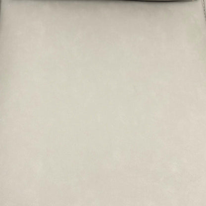 Close-up of the taupe faux leather used on the Catalina swivel dining chairs