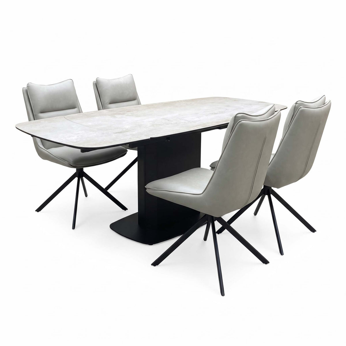Catalina extending ceramic top dining table with four taupe faux leather swivel chairs, angled view, table closed