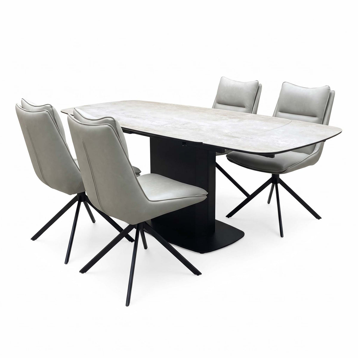 Catalina ceramic top table and taupe faux leather chairs angled from the left, chairs on black four-point swivel legs