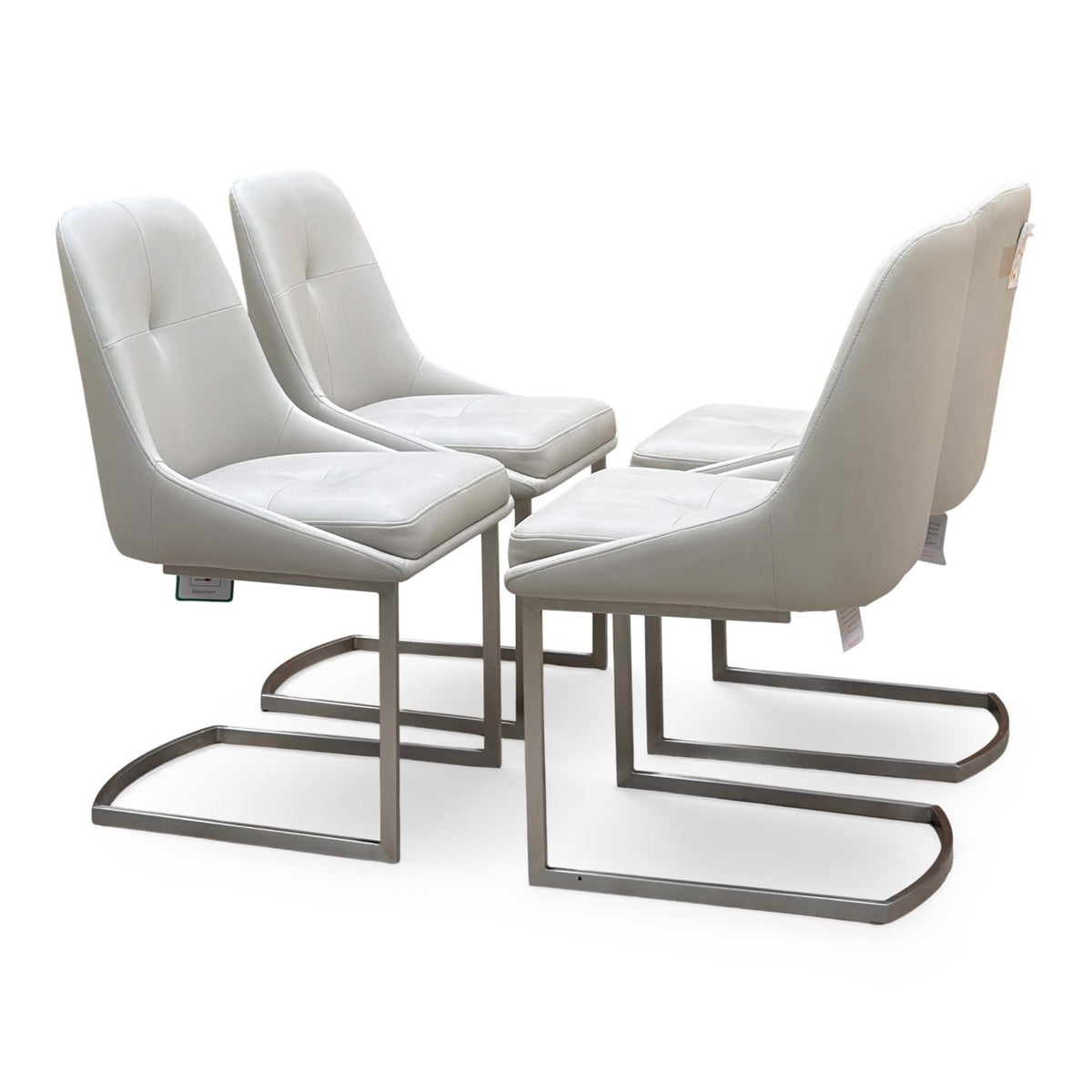 Avorio set of 4 faux leather cantilever dining chairs from the other angle, showing the curved shell backs