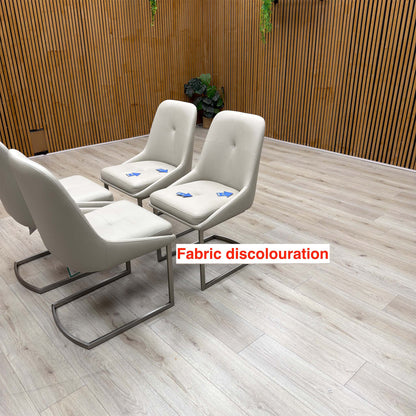 Avorio neutral faux leather dining chairs with discolouration marked by arrows on two of the seats