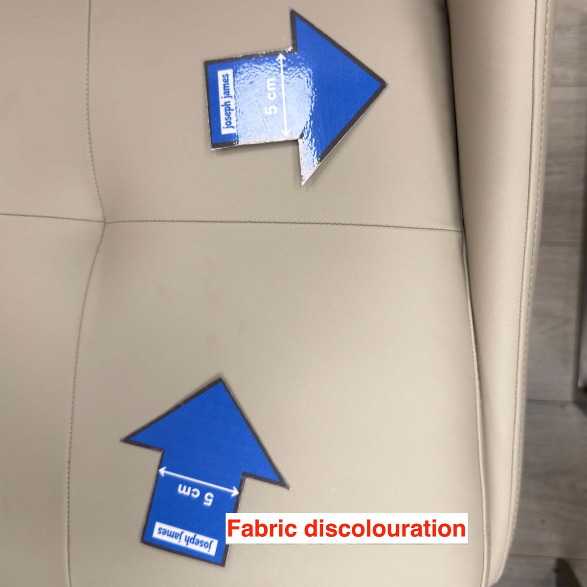 Closer view of the discolouration on the Avorio dining chair seat cushion, marked with 5cm arrows