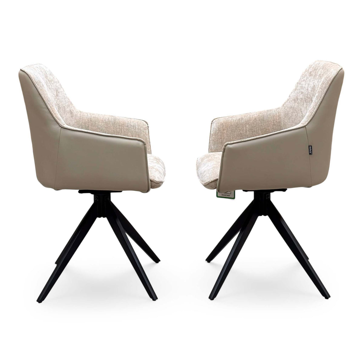 Side view of the pair of Jose arm chairs from the set with fabric backs and beige faux leather outer