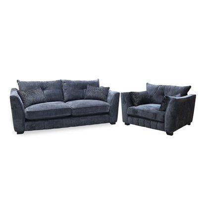 Allure indigo fabric classic back 3 seater sofa and snuggler chair, angled view with patterned scatter cushions
