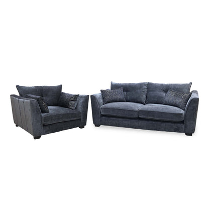Allure indigo fabric snuggler chair and 3 seater sofa angled from the left showing the sloped arms