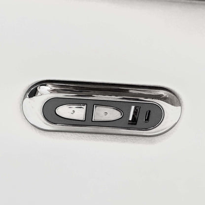 Close-up of the chrome power recline control with USB ports on the arm of the Sally light grey leather sofa