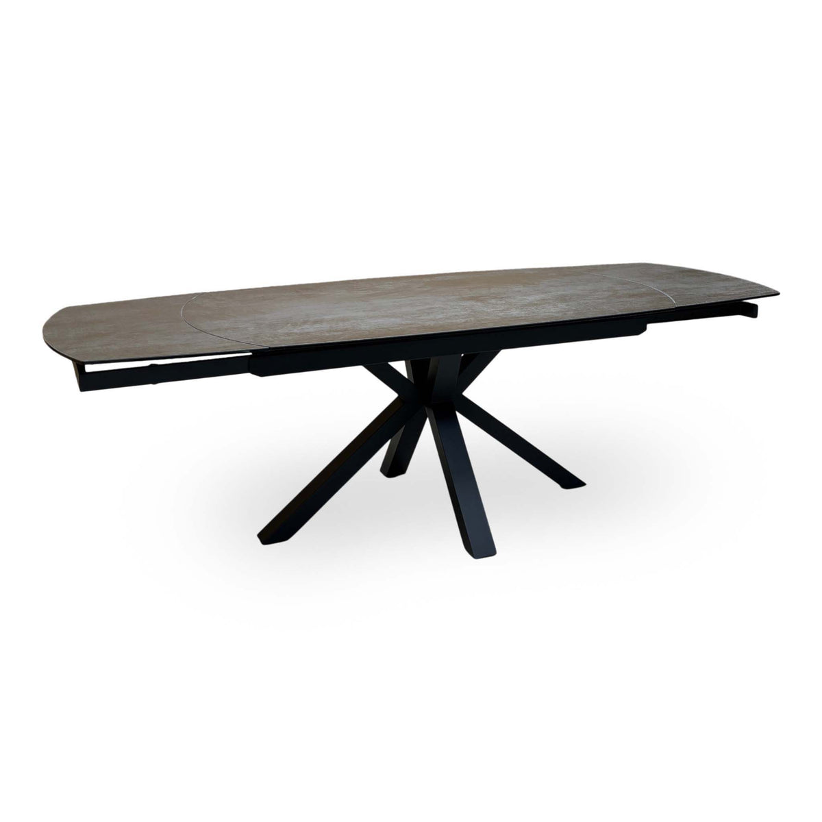 Raul titanium grey ceramic dining table extended, high angle showing the swivel extension leaves in place