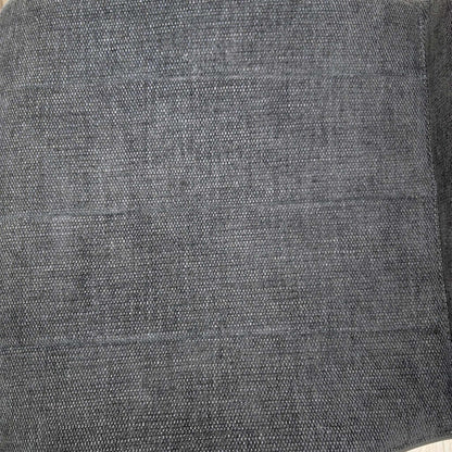 Close-up of the grey woven fabric used on the Raul swivel dining chairs