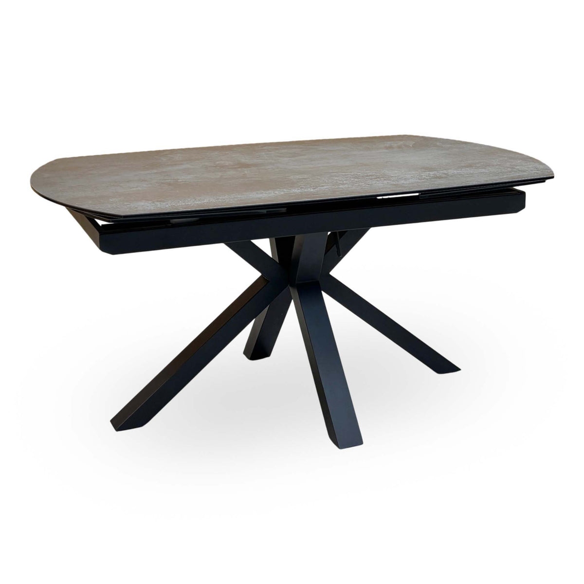 Raul titanium grey ceramic 160cm extending dining table on its own, angled view showing the black spider base