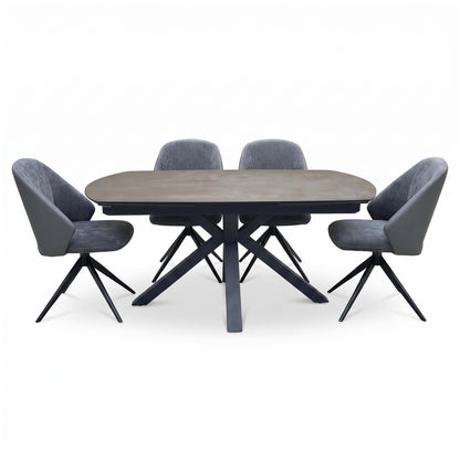 Front view of the Raul grey ceramic 160cm dining table closed, with 4 grey swivel dining arm chairs