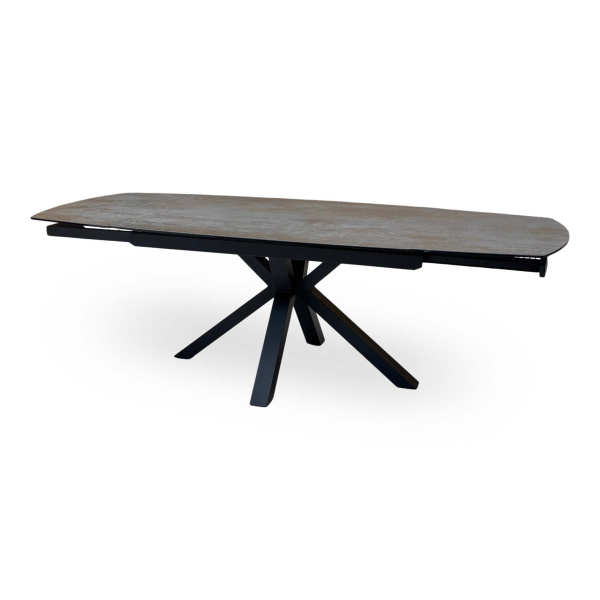 Raul grey ceramic swivel extending dining table fully open, low side angle of the black spider legs
