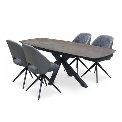 Raul grey ceramic dining table fully extended with 4 swivel chairs, side angle showing the extension leaves