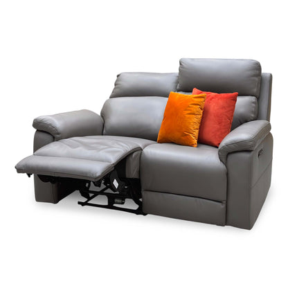 Raven elephant grey leather 2 seater sofa with the left seat power reclined, angled from the right