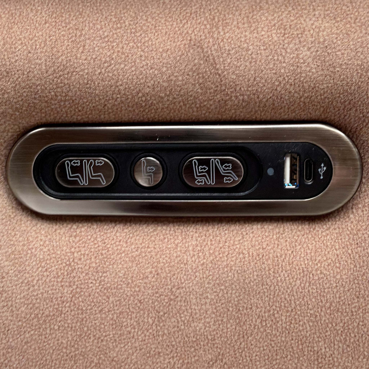 Close-up of the power recline and headrest buttons with USB port on the Moet sand beige velvet chair