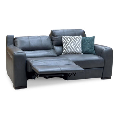 Marinelli Viali grey leather 3 seater power recliner sofa with the left seat reclined, angled view with cushions