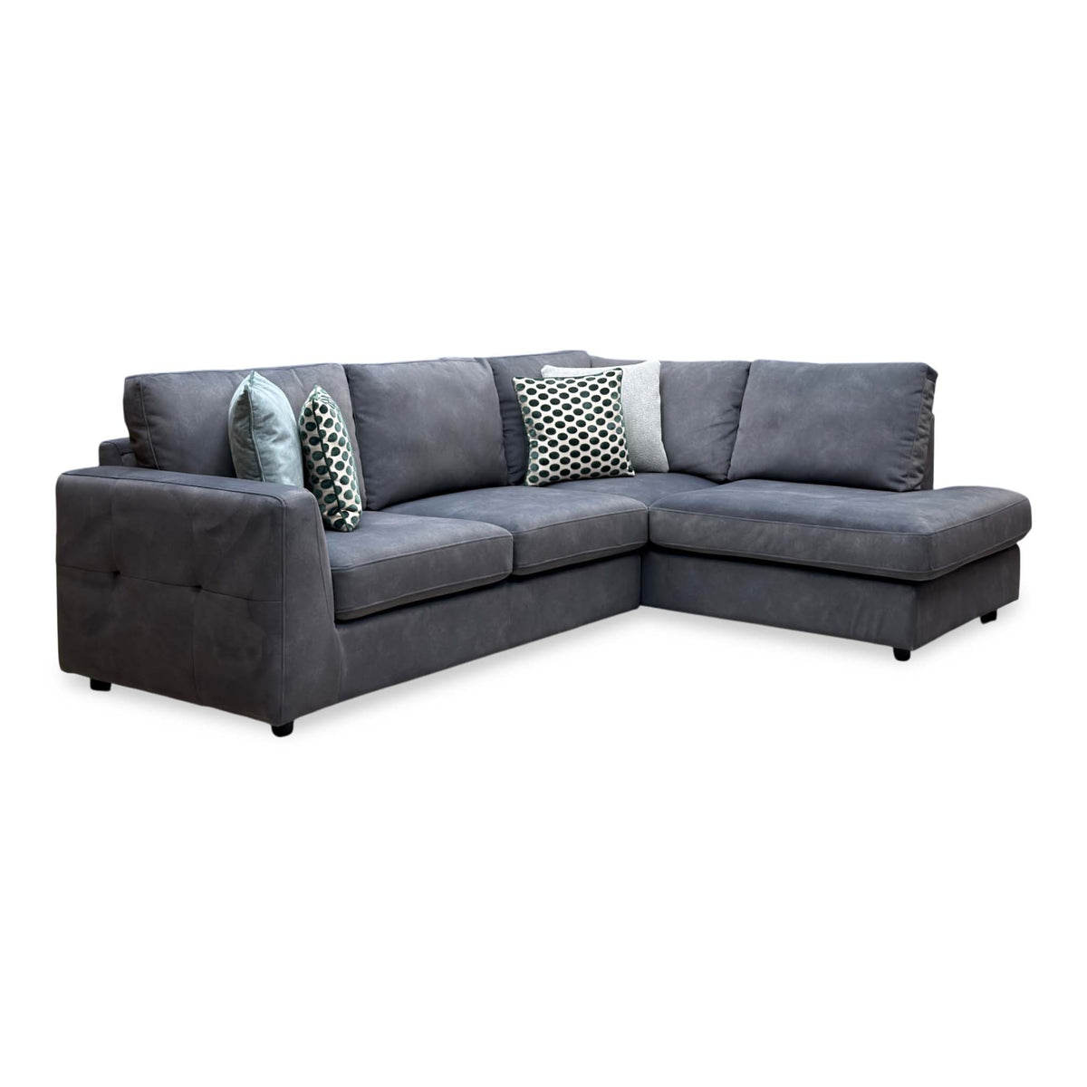 Dinky shadow grey velvet corner chaise end sofa, angled view from the left showing the buttoned arm