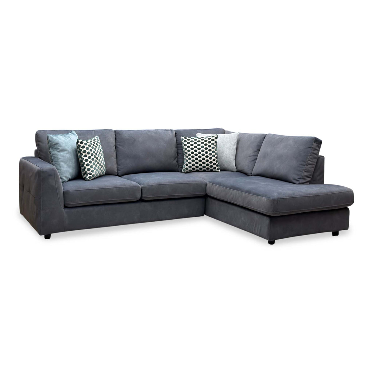 Dinky shadow grey velvet right hand facing corner chaise end sofa, angled view with patterned scatter cushions