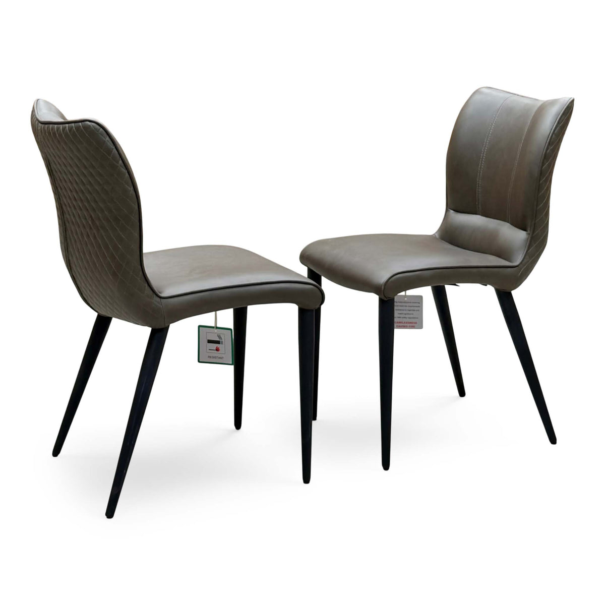 Murcia antiqued olive green pair of dining chairs with quilted backs and black tapered legs, angled view