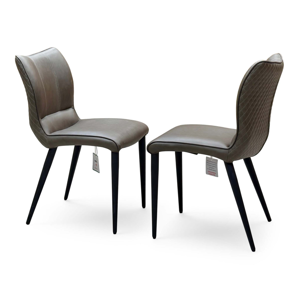 Murcia antiqued olive green pair of dining chairs angled from the left, swing tags attached