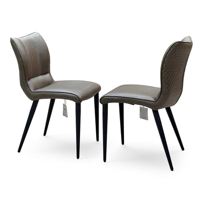 Murcia antiqued olive green pair of dining chairs angled from the left, swing tags attached