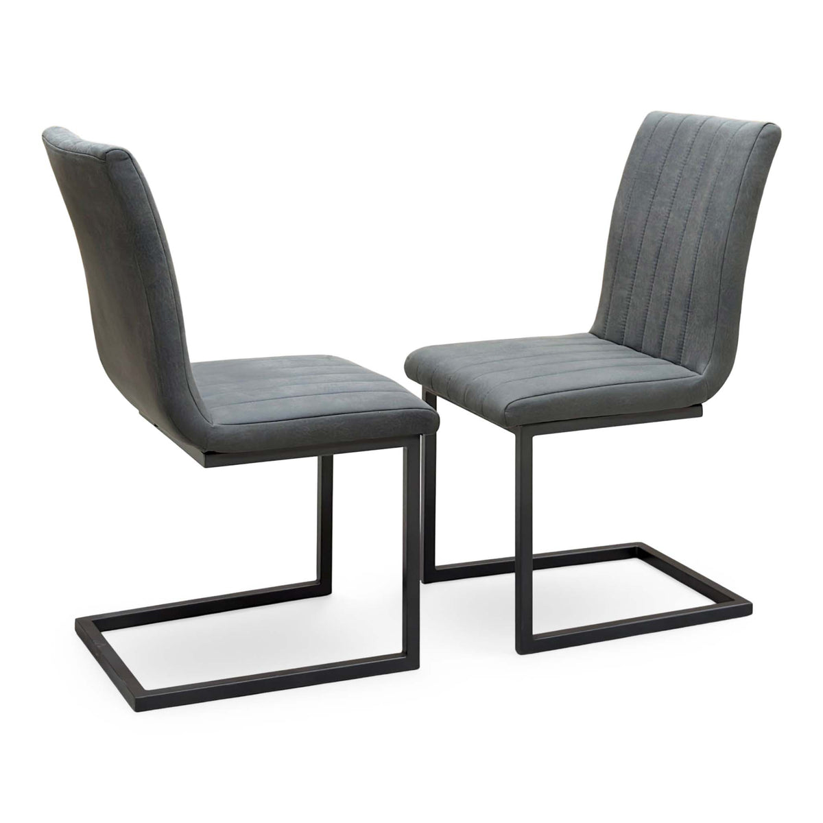 Moon grey fabric pair of cantilever dining chairs, angled view with one chair seen from behind