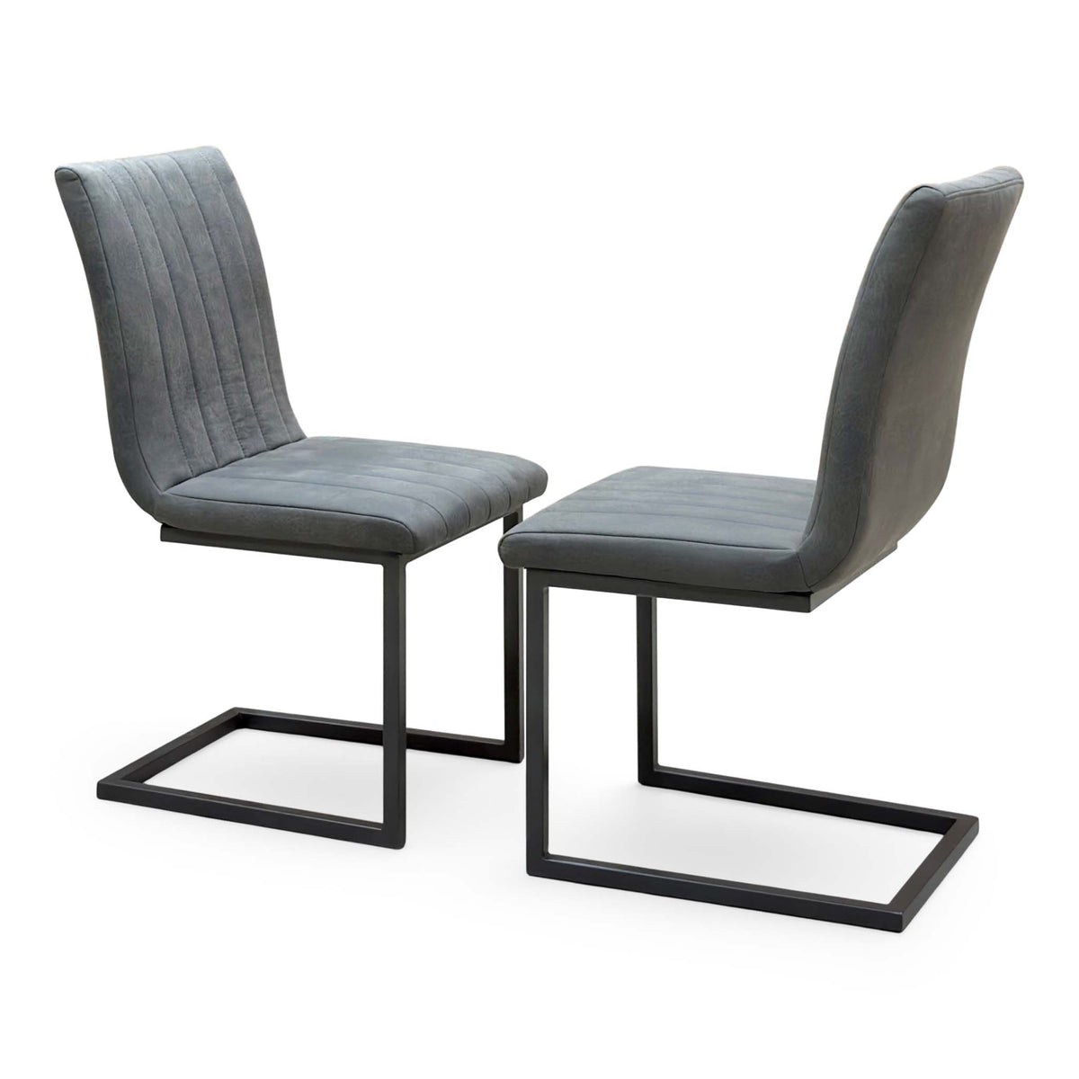 Pair of Moon grey fabric cantilever dining chairs, angled view showing the stitched channel backs and black frames