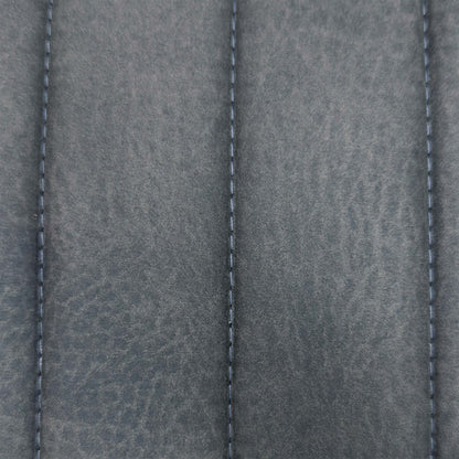 Close-up of the grey stitched channel fabric used on the Moon cantilever dining chairs