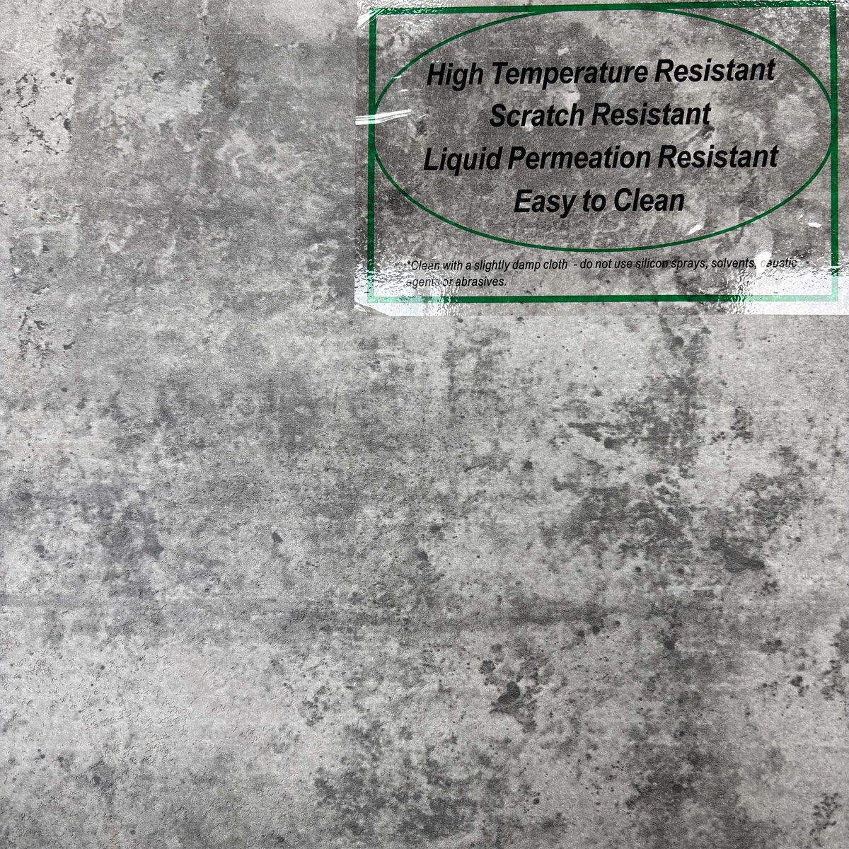 Close-up of the grey concrete effect top of the Moon sideboard with its care label