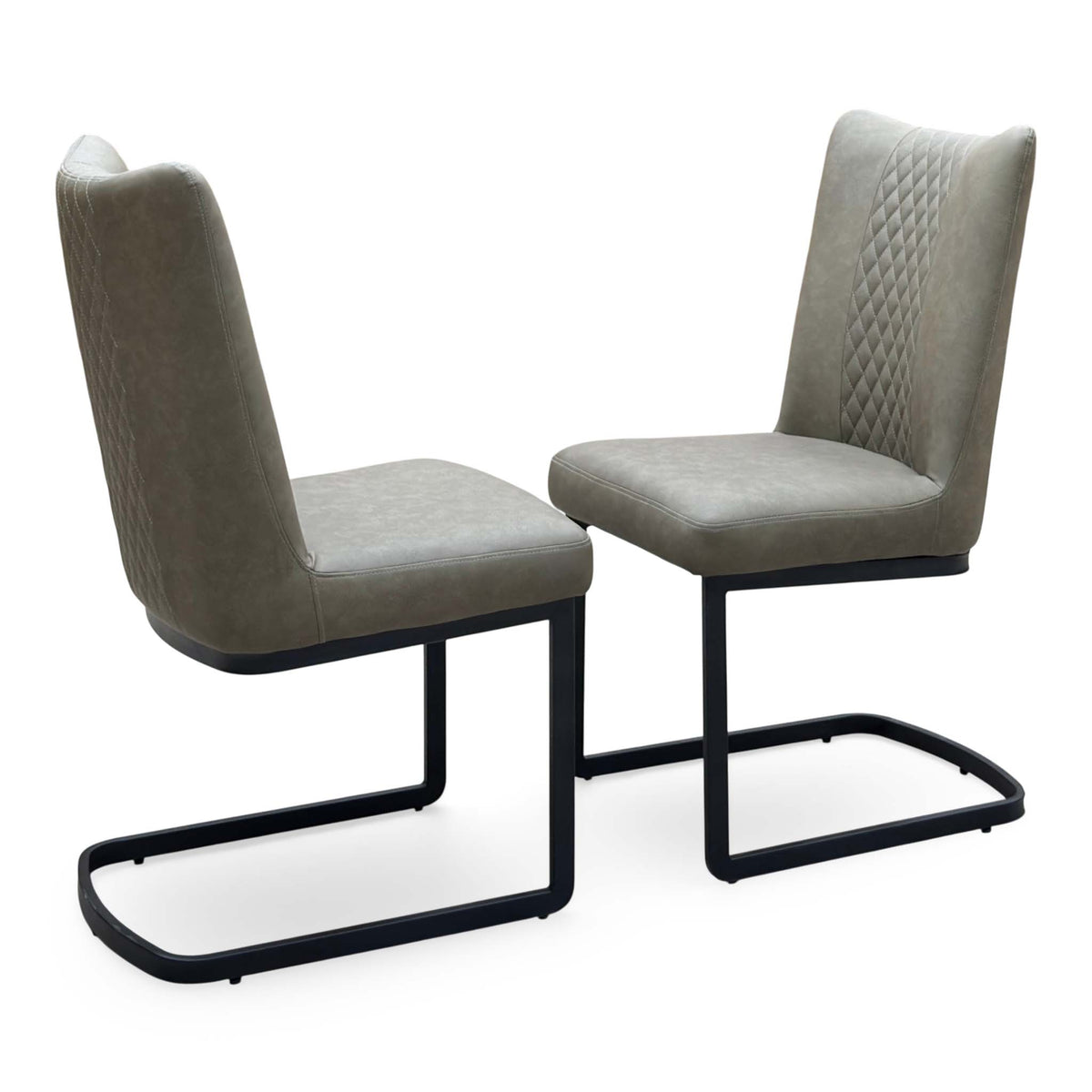 Bodahl Loki olive green fabric pair of cantilever dining chairs, one turned to show the diamond-quilted back