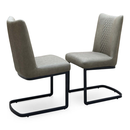 Bodahl Loki olive green fabric pair of cantilever dining chairs, one turned to show the diamond-quilted back
