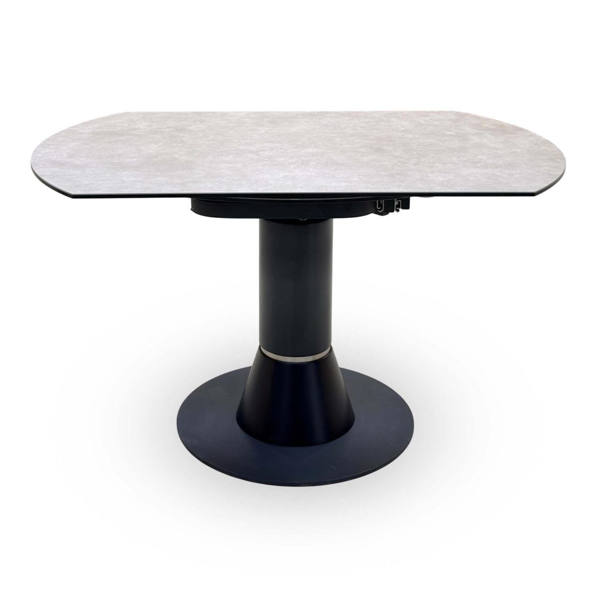 Front view of the Enterprise grey ceramic top dining table closed, on a black tapered pedestal with round base