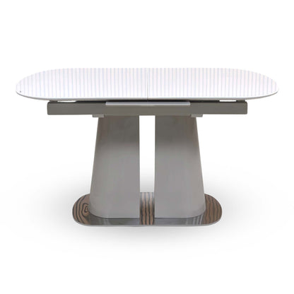 Front view of the Cashmere white tempered glass top small extending dining table on its grey twin pedestal