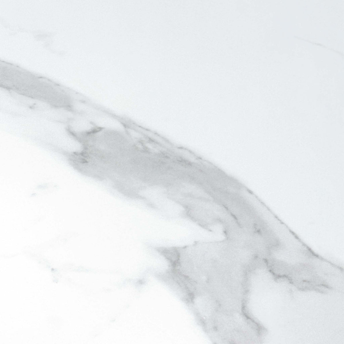 Close-up of the white marble effect ceramic with grey veining used on the Carrera dining table
