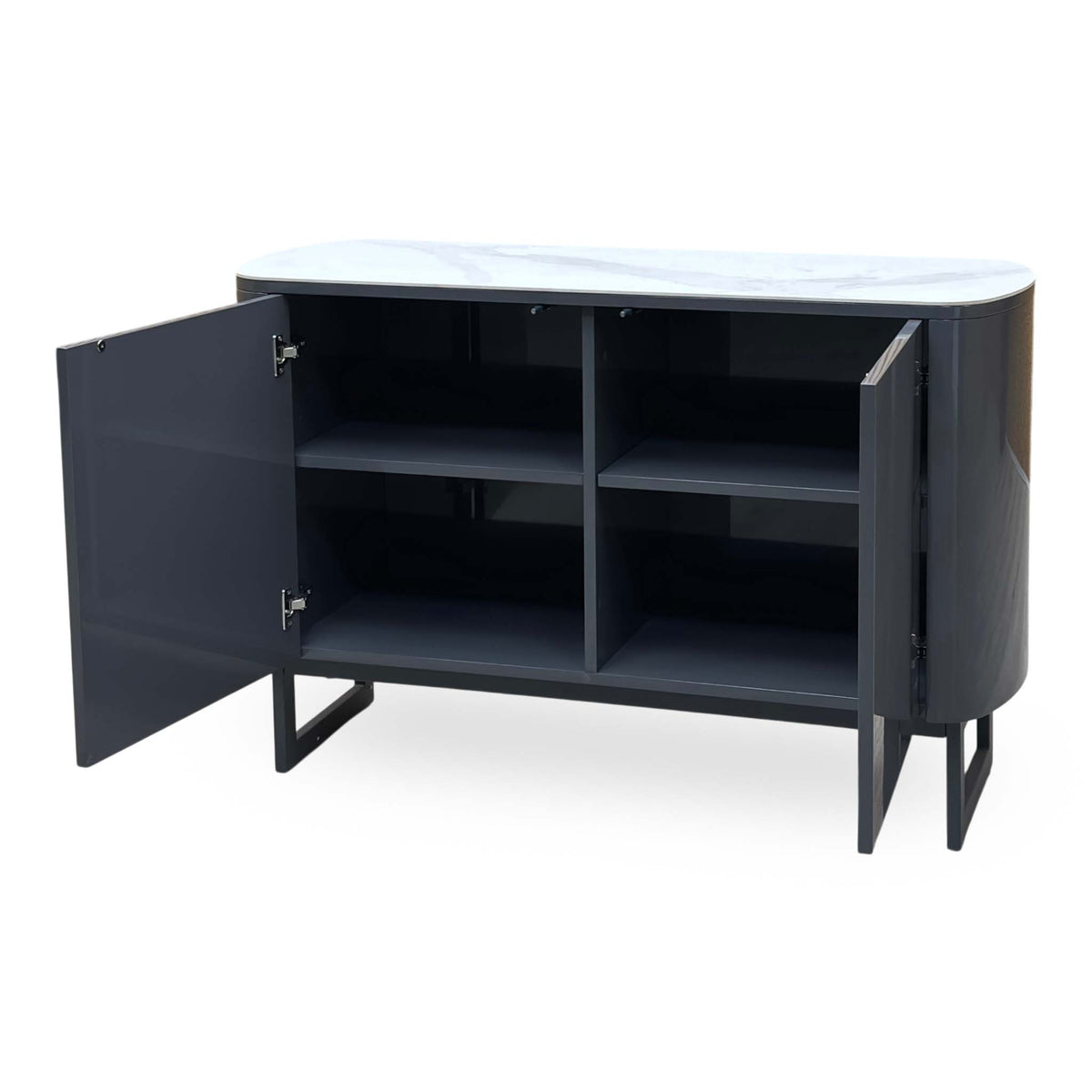 Carrera ceramic top small sideboard with the left door open, angled from the left