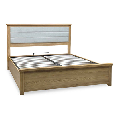 Augusta solid oak super king ottoman bed frame angled from the left with a padded grey headboard