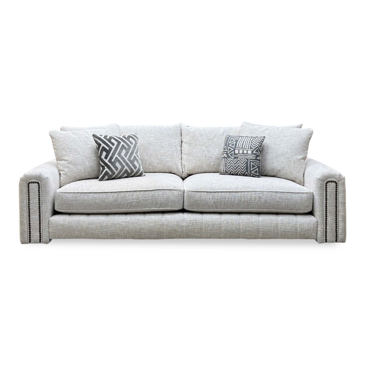 Front view of the Retreat white woven fabric 4 seater sofa with studded arms and scatter cushions