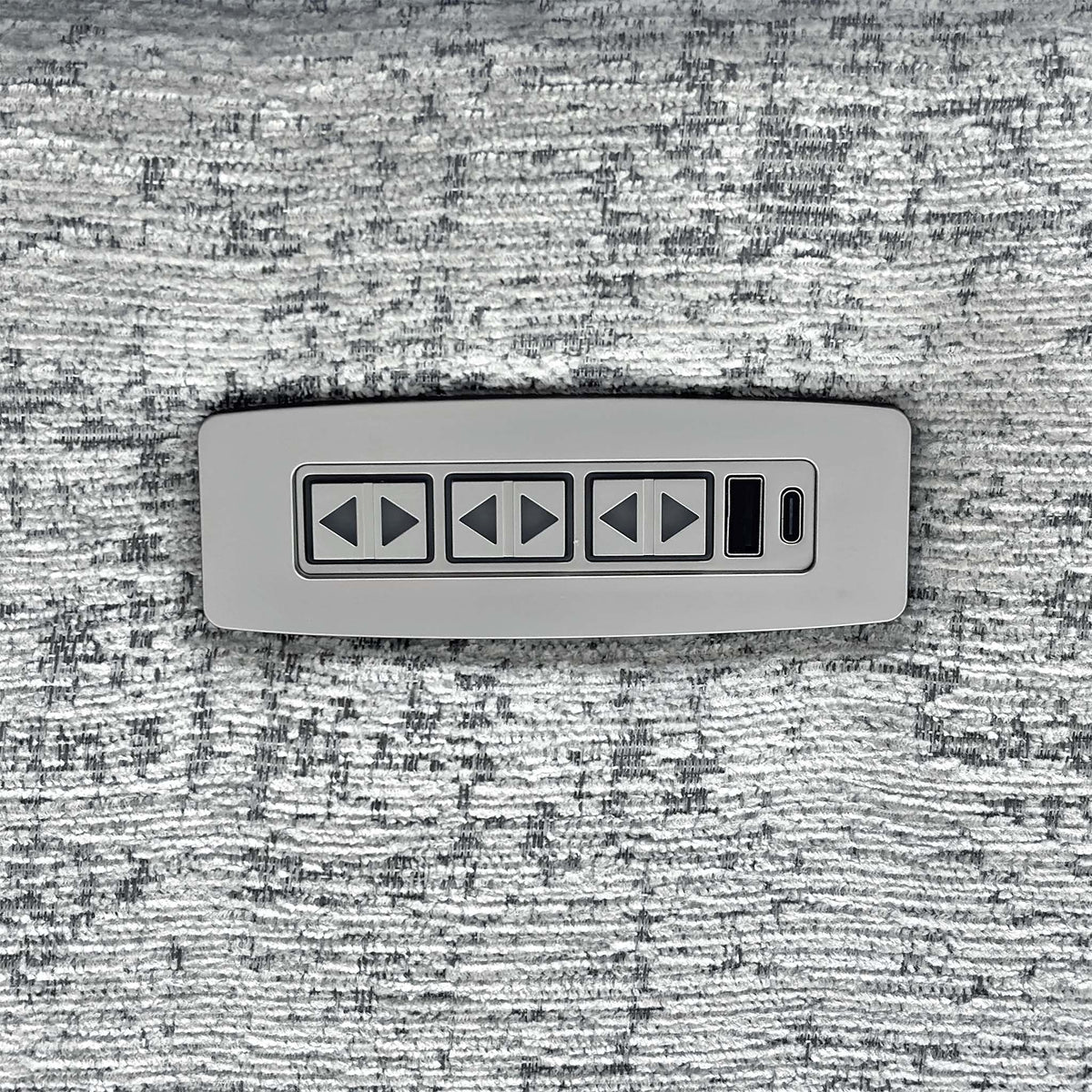 Close-up of the three-button power panel for recline, headrest and lumbar on the G Plan Kingsbury sofa