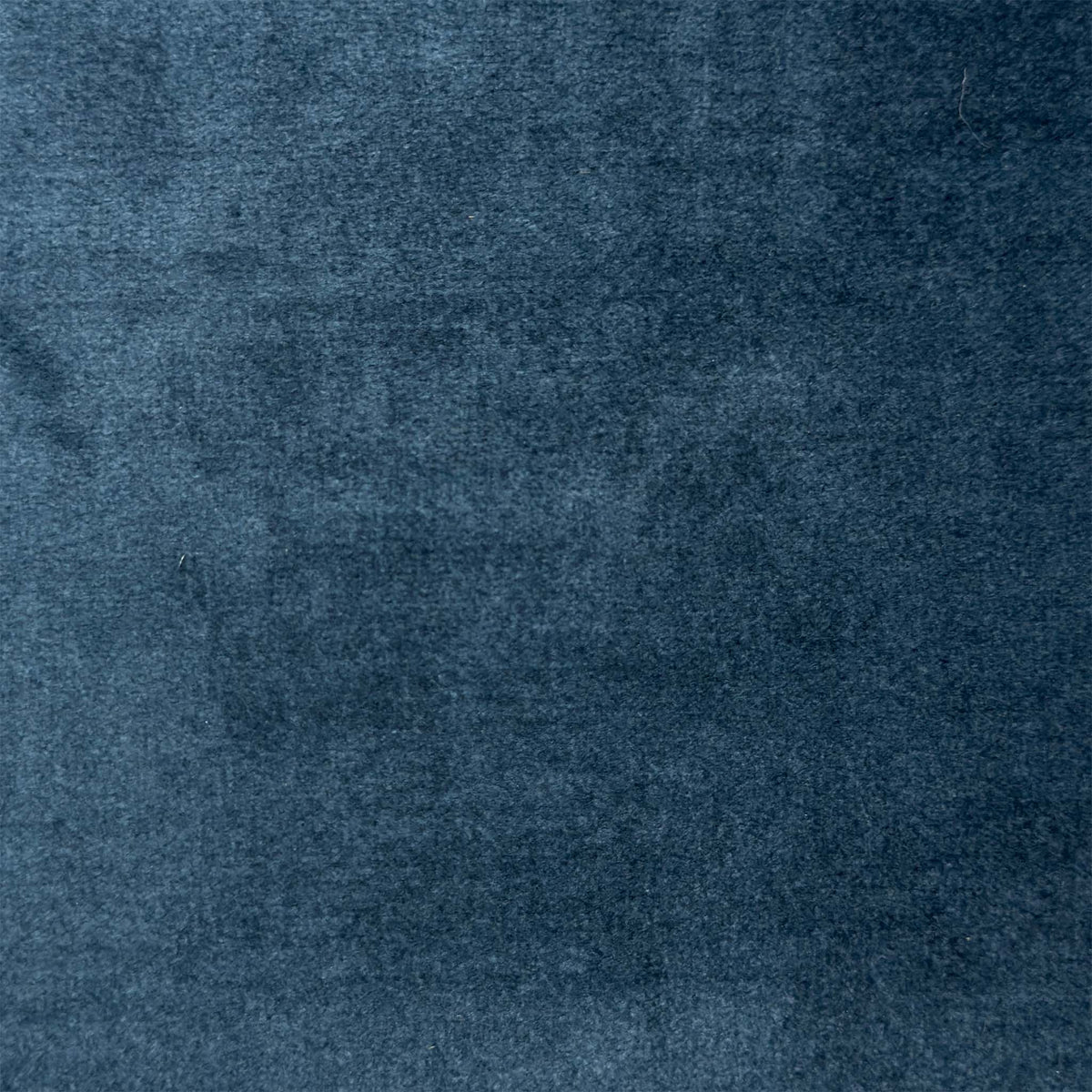 Close-up of the navy blue velvet fabric used on the Genius storage footstool