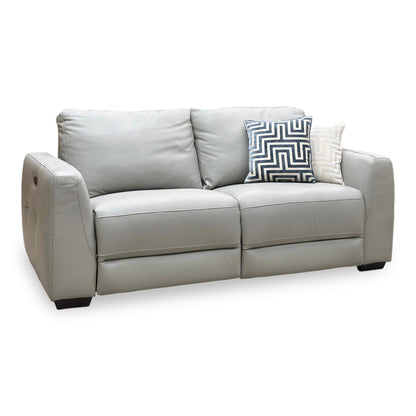 Angled view of the Dinky light grey leather 3 seater power recliner sofa upright, control panel on the left arm