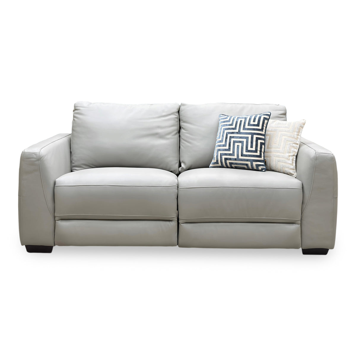 Front view of the Dinky light grey leather 3 seater power recliner sofa with two scatter cushions