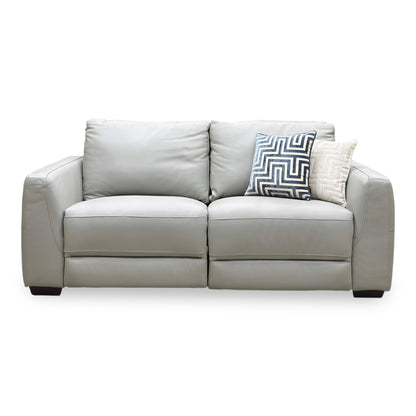 Front view of the Dinky light grey leather 3 seater power recliner sofa with two scatter cushions