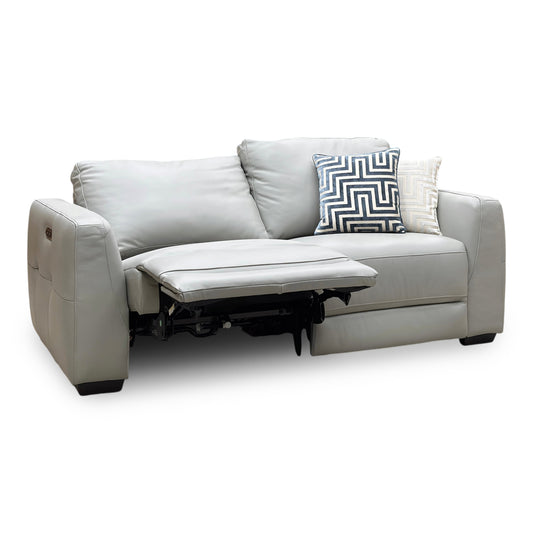 Dinky light grey leather 3 seater power recliner sofa, angled view with the left seat reclined and footrest raised