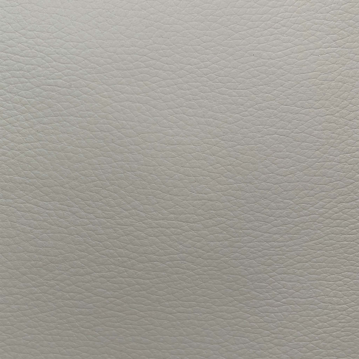 Close-up of the light grey grained leather used on the Dinky power recliner sofa
