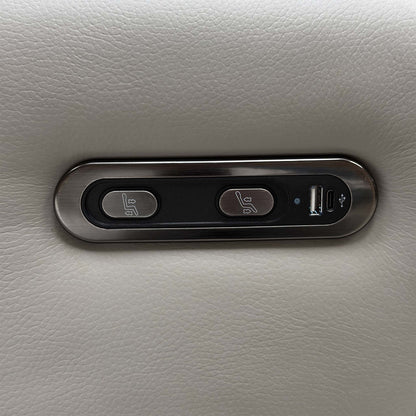 Close-up of the power recline control panel with USB port on the arm of the Dinky light grey leather sofa