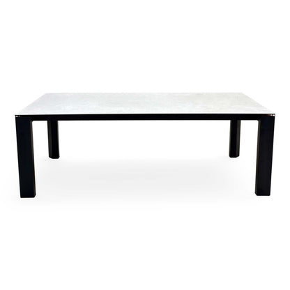 Front view of the Connubia Viola light grey ceramic top 220cm dining table on black metal legs