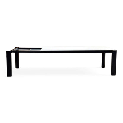 Side-on view of the Connubia Viola light grey ceramic top dining table showing the black metal frame and legs