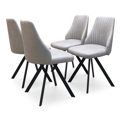 Vida taupe faux leather set of 4 swivel dining chairs, angled view with pleated backs and black legs