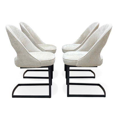 Side angle of the four Tiber alabaster beige fabric cantilever chairs in two facing pairs