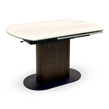 Tiber travertine ceramic table closed, angled from the right showing the swivel top mechanism underneath
