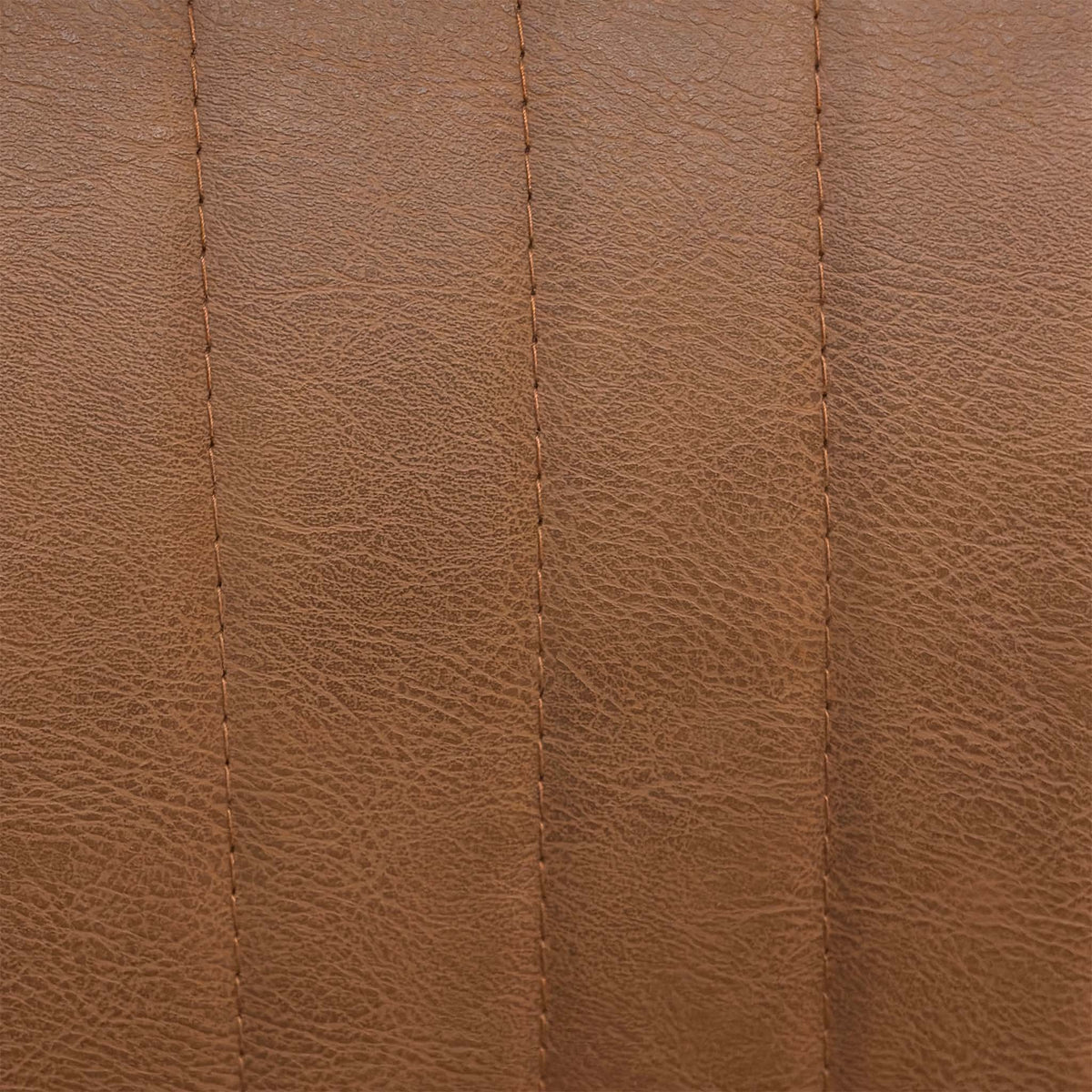 Close-up of the cognac brown faux leather with vertical stitching used on the Bodahl Terra bar stools